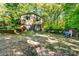 Home exterior showing a two car garage, shed and outdoor furnishings at 6766 Little Mountain Rd, Sherrills Ford, NC 28673