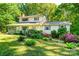 Charming two-story home with a welcoming front porch and beautifully landscaped yard at 6766 Little Mountain Rd, Sherrills Ford, NC 28673