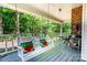 Relaxing porch with a swing, comfortable seating, and serene outdoor views, perfect for enjoying the natural surroundings at 6766 Little Mountain Rd, Sherrills Ford, NC 28673