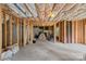 Spacious unfinished basement with exposed ceiling insulation and a framed-in room, ready for customization at 7049 Sedgebrook W Dr, Stanley, NC 28164
