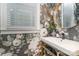 A stylish powder room featuring floral wallpaper, round mirror, and a modern sink at 710 Morgan Park Dr, Charlotte, NC 28204