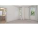 Neutral bedroom with two windows dressed with floor length linen drapes and carpeted floor at 710 Morgan Park Dr, Charlotte, NC 28204