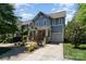 Charming two-story home with a covered front porch, garage, and beautiful landscaping at 710 Morgan Park Dr, Charlotte, NC 28204