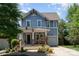 Charming two-story home featuring a covered front porch and well-manicured landscaping at 710 Morgan Park Dr, Charlotte, NC 28204