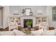 Cozy living room with a fireplace, built-in bookshelves, and neutral decor at 710 Morgan Park Dr, Charlotte, NC 28204