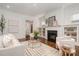 Bright living room with fireplace, hardwood floors, and an open floor plan at 710 Morgan Park Dr, Charlotte, NC 28204