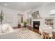 Bright living room with fireplace, hardwood floors, and an open floor plan at 710 Morgan Park Dr, Charlotte, NC 28204