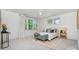 Serene bedroom with accent furniture, area rug, and a large window at 710 Morgan Park Dr, Charlotte, NC 28204