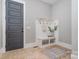 Functional mudroom featuring a built-in bench, hooks, and neutral tile flooring at 710 Morgan Park Dr, Charlotte, NC 28204