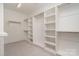 A walk-in closet featuring built-in shelving and ample storage space at 710 Morgan Park Dr, Charlotte, NC 28204
