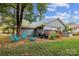 Inviting backyard deck with a grill, seating, and plenty of room to enjoy the outdoors at 712 Grace Ave, Kannapolis, NC 28083