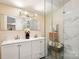 Modern bathroom featuring double sinks, large mirrors, and a glass door walk-in shower at 712 Grace Ave, Kannapolis, NC 28083
