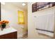 Bright bathroom featuring a modern vanity, wood style floor, and neutral wall paint color at 712 Grace Ave, Kannapolis, NC 28083