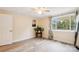 Sunlit bedroom features wood-look flooring, bright natural light, and white trim at 712 Grace Ave, Kannapolis, NC 28083