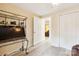 Bright bedroom with light floors, closet, and open doorway to another room at 712 Grace Ave, Kannapolis, NC 28083