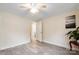 Bright bedroom with wood-look flooring and natural light leading to hall at 712 Grace Ave, Kannapolis, NC 28083