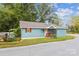 Charming blue home with a small front porch and well-maintained landscaping at 712 Grace Ave, Kannapolis, NC 28083