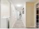 Hallway featuring wood floors and a laundry area with natural light at 712 Grace Ave, Kannapolis, NC 28083