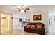 Comfortable living room with brown leather sofa and doorway views to kitchen and a bright bathroom at 712 Grace Ave, Kannapolis, NC 28083