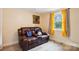 Cozy room featuring a plush leather sofa, natural light, and wood style floor at 712 Grace Ave, Kannapolis, NC 28083
