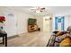 Cozy living room with a ceiling fan, a television, and a comfortable brown leather couch with colorful pillows at 712 Grace Ave, Kannapolis, NC 28083