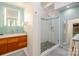 Bright bathroom featuring a glass shower, modern vanity, and stylish tile accents at 714 Larkhall Ln, Charlotte, NC 28211