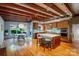 Open kitchen featuring wood cabinets, center island, stainless steel appliances, and dining table near the window at 714 Larkhall Ln, Charlotte, NC 28211