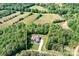 Estate aerial view features picturesque acreage and a well-maintained home nestled among lush trees at 730 Oak Ridge Farms Cir # 14, Newton, NC 28658