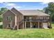 Stately brick home with a large wooden deck, perfect for outdoor entertaining and enjoying the backyard view at 730 Oak Ridge Farms Cir # 14, Newton, NC 28658