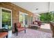 Relaxing covered back porch with outdoor seating, perfect for enjoying the peaceful surroundings at 730 Oak Ridge Farms Cir # 14, Newton, NC 28658