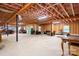 Unfinished basement showcasing ample space with exposed ceiling and wooden framing, ideal for storage at 730 Oak Ridge Farms Cir # 14, Newton, NC 28658
