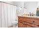 Bathroom featuring a shower curtain, dark wood cabinets, and granite countertop at 730 Oak Ridge Farms Cir # 14, Newton, NC 28658