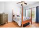 Bedroom featuring a four poster bed, dresser, and hardwood floors at 730 Oak Ridge Farms Cir # 14, Newton, NC 28658