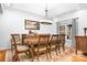 Elegant dining room with a large wooden table, seating for eight, and classic decor at 730 Oak Ridge Farms Cir # 14, Newton, NC 28658