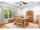 Bright dining room with large window, wooden table and chairs, and built-in cabinet at 730 Oak Ridge Farms Cir # 14, Newton, NC 28658