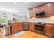 Well-equipped kitchen with stainless steel appliances, tiled backsplash, and plenty of counter space at 730 Oak Ridge Farms Cir # 14, Newton, NC 28658