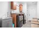 Well-organized laundry room featuring cabinetry, granite countertop, sink, and modern washer and dryer at 730 Oak Ridge Farms Cir # 14, Newton, NC 28658