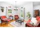 Charming sitting room with hardwood floors, bright windows, and comfortable wicker furniture at 730 Oak Ridge Farms Cir # 14, Newton, NC 28658