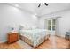 Bright main bedroom features hardwood floors, tray ceilings, and lots of natural light at 730 Oak Ridge Farms Cir # 14, Newton, NC 28658
