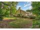 This serene backyard, complete with a fence, offers a private and tranquil space surrounded by lush greenery at 752 Pinebough Ln, Rock Hill, SC 29732