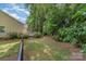 The expansive yard has mature trees creating a private outdoor retreat for relaxation and entertainment at 752 Pinebough Ln, Rock Hill, SC 29732