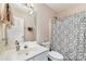 Well-lit bathroom with a vanity and a shower featuring a patterned curtain for added privacy at 752 Pinebough Ln, Rock Hill, SC 29732