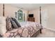 Comfortable bedroom with a four-poster bed, carpeted floors, and a large window providing natural light at 752 Pinebough Ln, Rock Hill, SC 29732