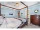 Bedroom featuring a four-poster bed, vaulted ceilings, and a view to the ensuite bathroom at 752 Pinebough Ln, Rock Hill, SC 29732