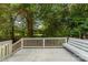 A view of the spacious deck with seating and railing overlooking the tranquil and private backyard at 752 Pinebough Ln, Rock Hill, SC 29732