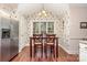 Cozy dining area featuring a window, wooden floors, and an elegant chandelier at 752 Pinebough Ln, Rock Hill, SC 29732