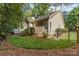 A well-maintained home has an expansive lawn and fenced backyard, offering privacy and a manicured landscape at 752 Pinebough Ln, Rock Hill, SC 29732