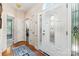 Inviting foyer featuring hardwood floors, decorative glass door, and arched transom window at 752 Pinebough Ln, Rock Hill, SC 29732