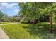 This well-manicured front lawn is framed by mature trees, enhances the property's curb appeal and natural beauty at 752 Pinebough Ln, Rock Hill, SC 29732