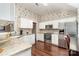 Well-lit kitchen features granite countertops, stainless steel appliances, and white cabinetry at 752 Pinebough Ln, Rock Hill, SC 29732